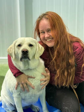 Team member with dog